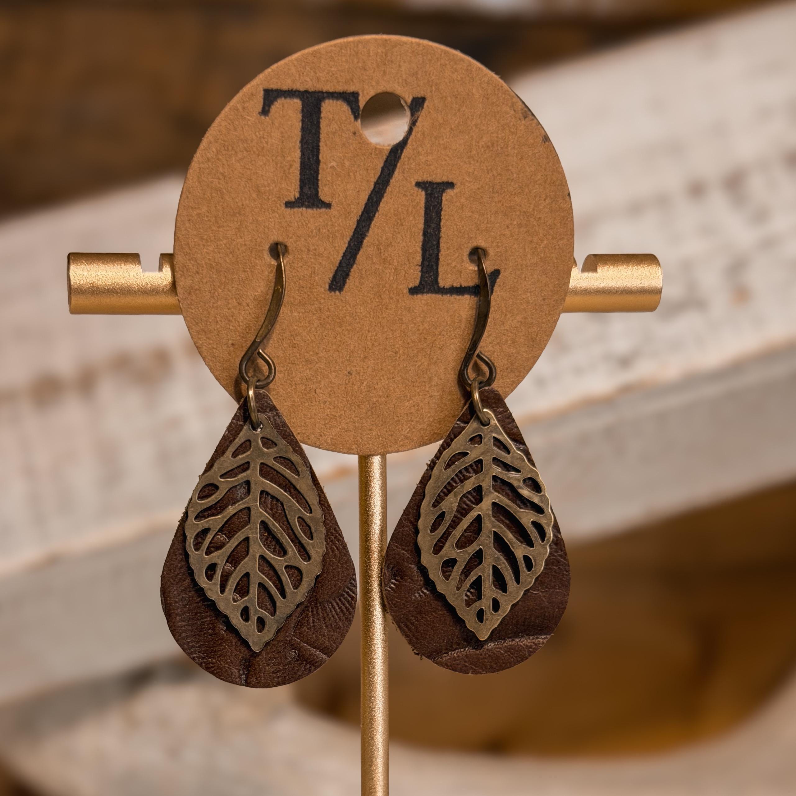 Leather earrings with leaf accent