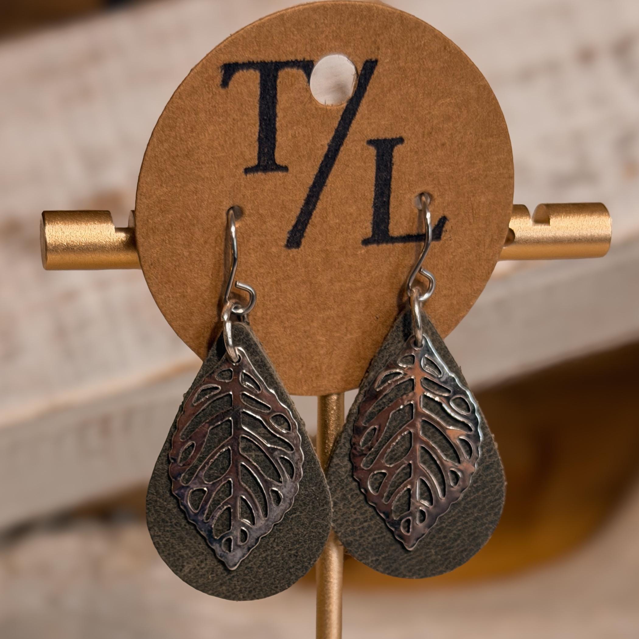 Leather earrings with leaf accent